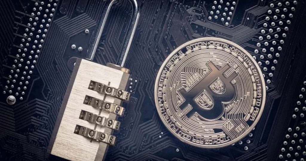 A Bitcoin coin next to a lock