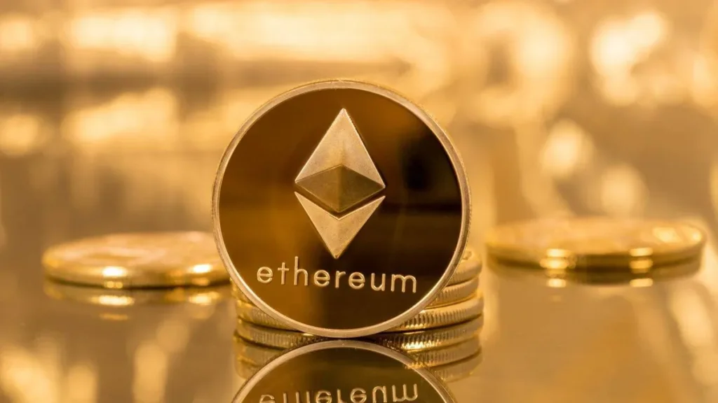 A gold coin with the Ethereum logo