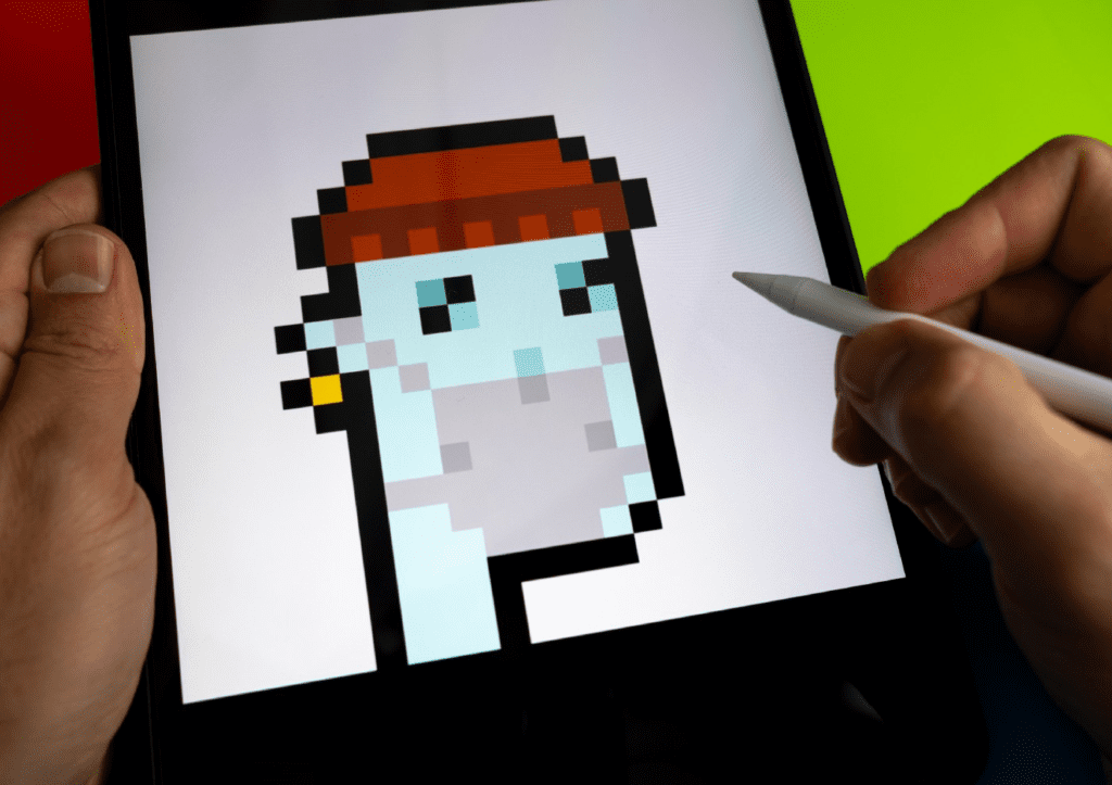 picture of a person drawing an NFT in the iPad